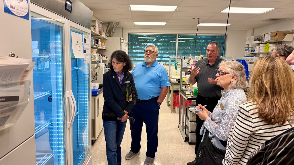 Guests at an open house at Iowa Lions Eye Bank check out newly purchased equipment.